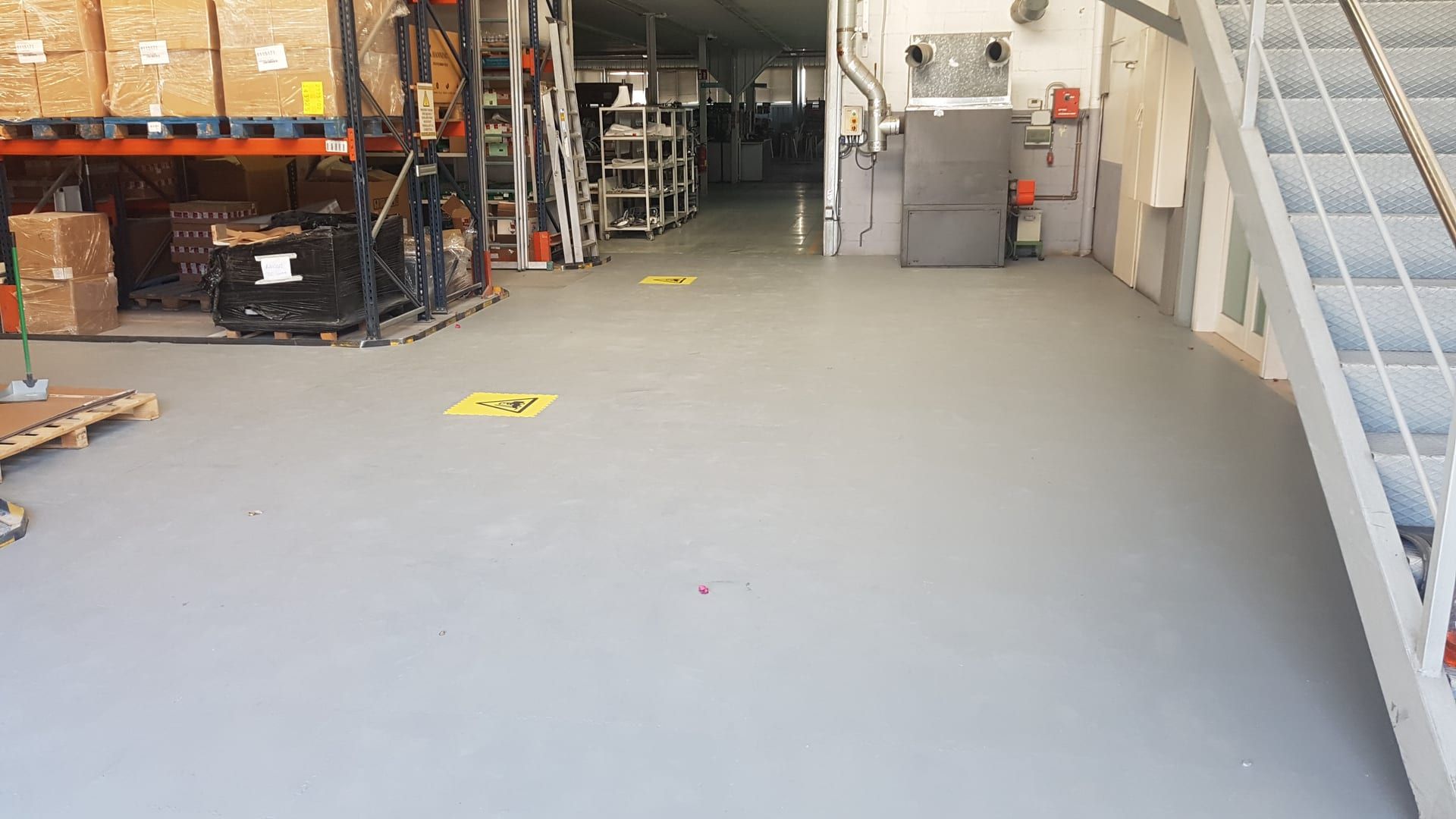 Professional flooring installed in a factory warehouse